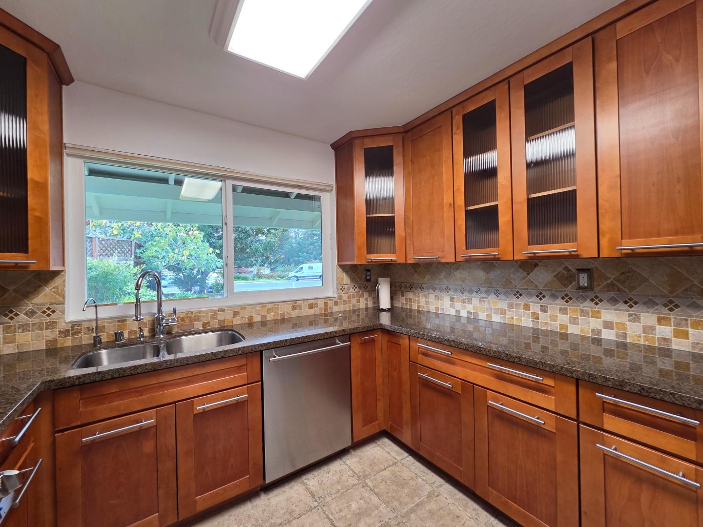 50 Nottingham Place Clayton, CA 94517 - Photo 13 of 41 a kitchen with stainless steel appliances granite countertop sink stove and microwave