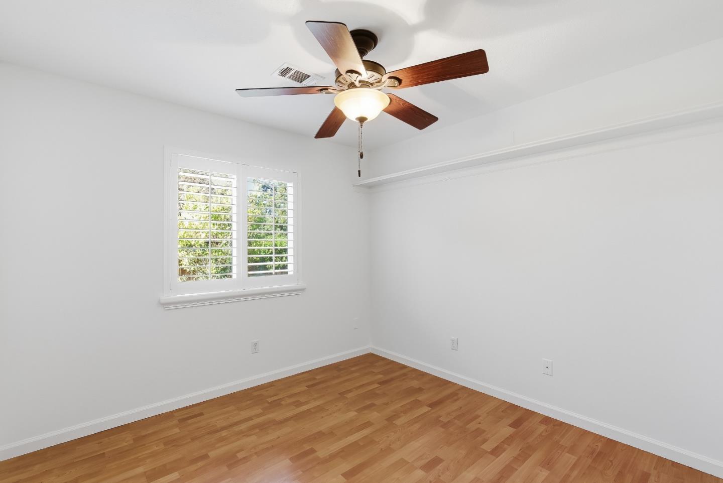 50 Nottingham Place Clayton, CA 94517 - Photo 23 of 41 an empty room with ceiling fan and window