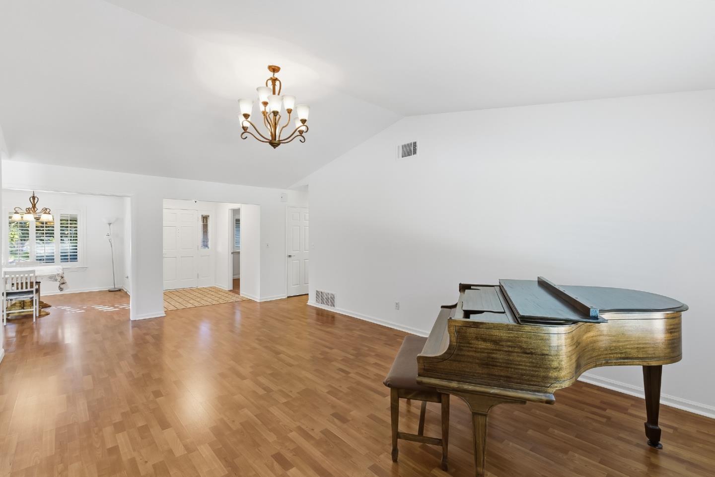 50 Nottingham Place Clayton, CA 94517 - Photo 4 of 41 a view of a livingroom with wooden floor and a chandelier