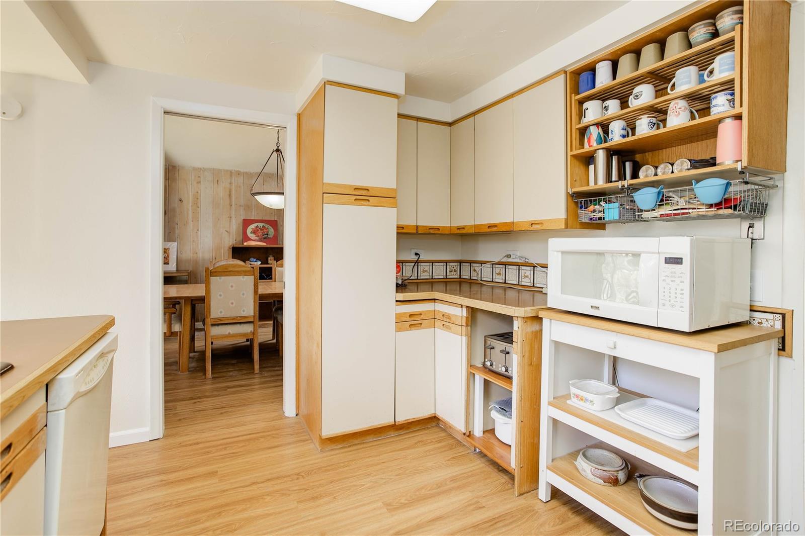 7347 South Ridgeview Drive Littleton, CO 80120 - Photo 11 of 36 a kitchen with stainless steel appliances a stove and a refrigerator