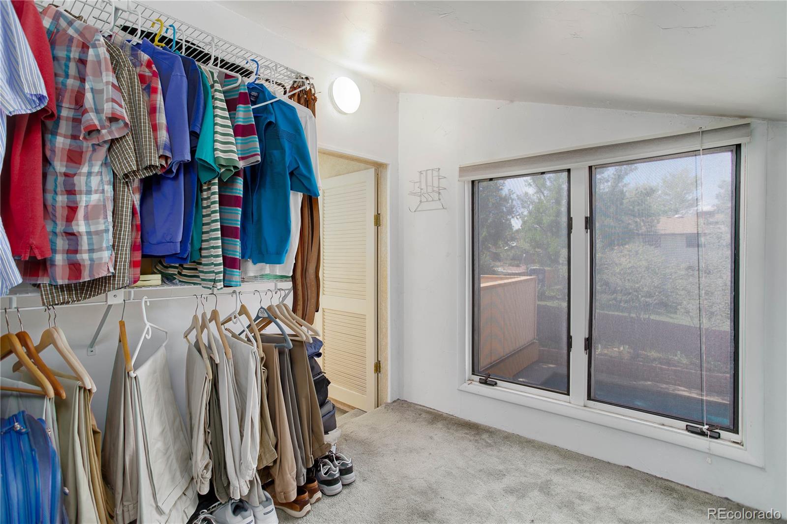 7347 South Ridgeview Drive Littleton, CO 80120 - Photo 19 of 36 a view of walk in closet with clothes