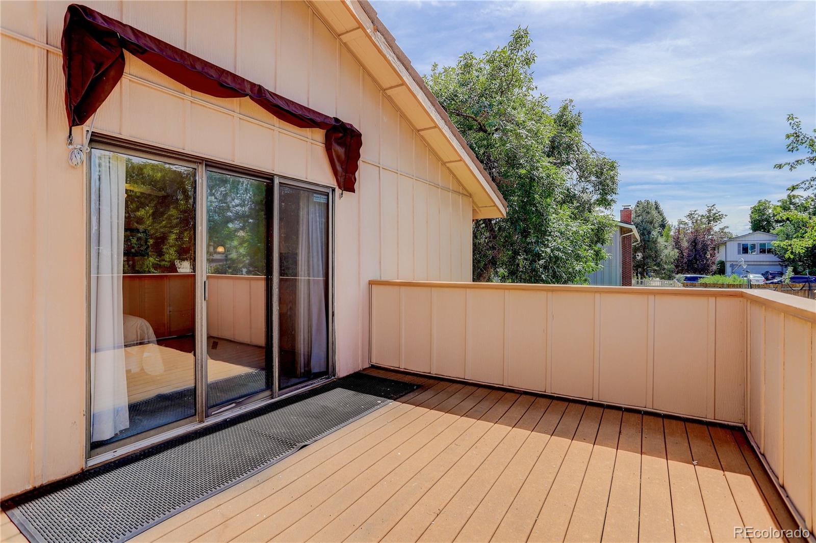 7347 South Ridgeview Drive Littleton, CO 80120 - Photo 20 of 36 a view of a room with wooden floor and iron stairs