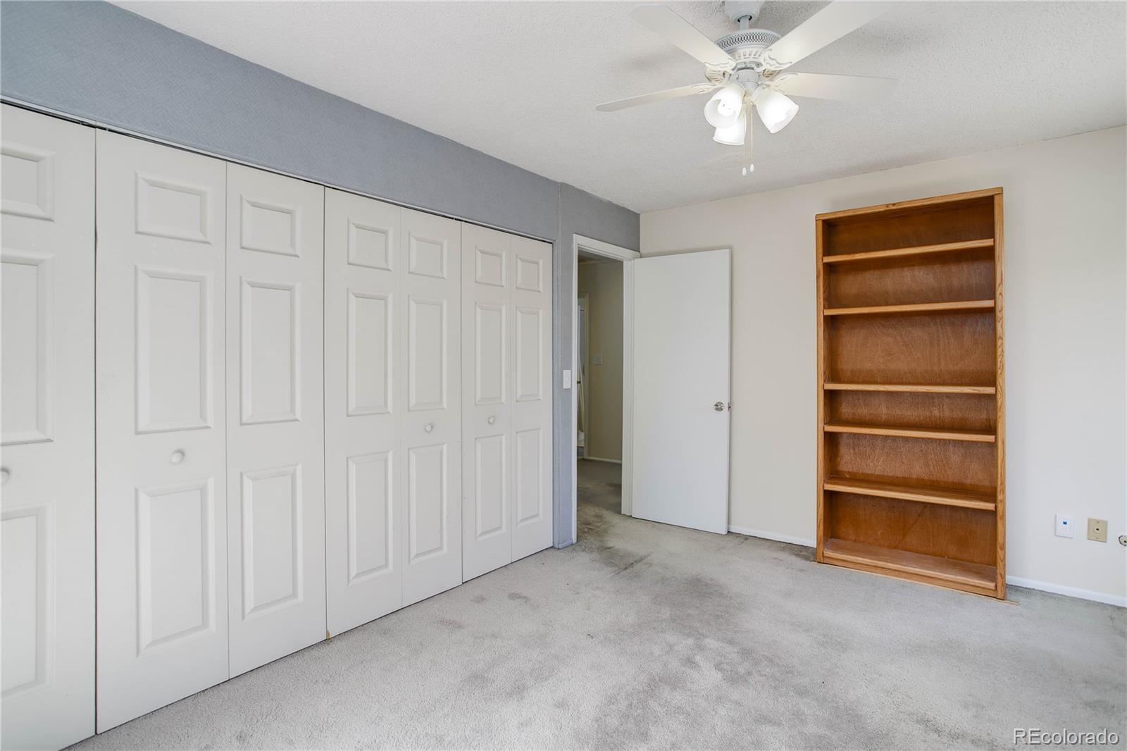 7347 South Ridgeview Drive Littleton, CO 80120 - Photo 23 of 36 a view of an empty room with a ceiling fan