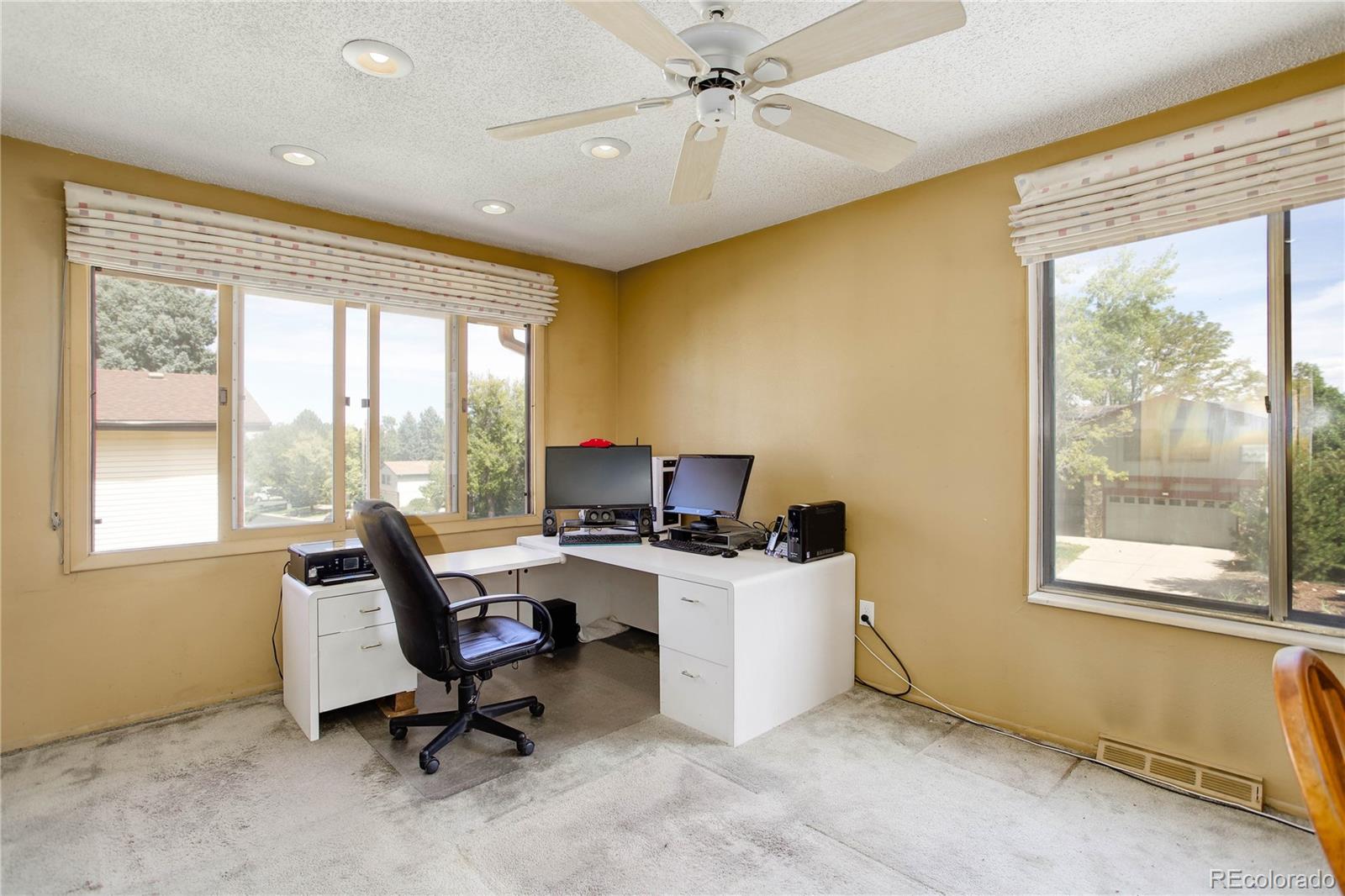 7347 South Ridgeview Drive Littleton, CO 80120 - Photo 27 of 36 a view of a workspace with furniture and a window