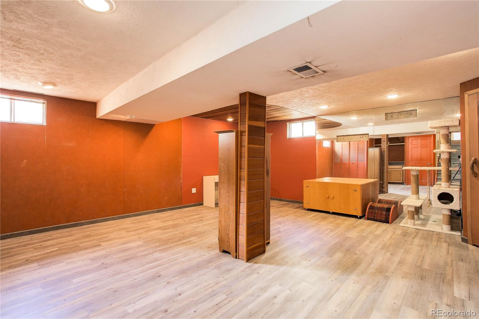 7347 South Ridgeview Drive Littleton, CO 80120 - Photo 29 of 36 a view of a livingroom with wooden floor