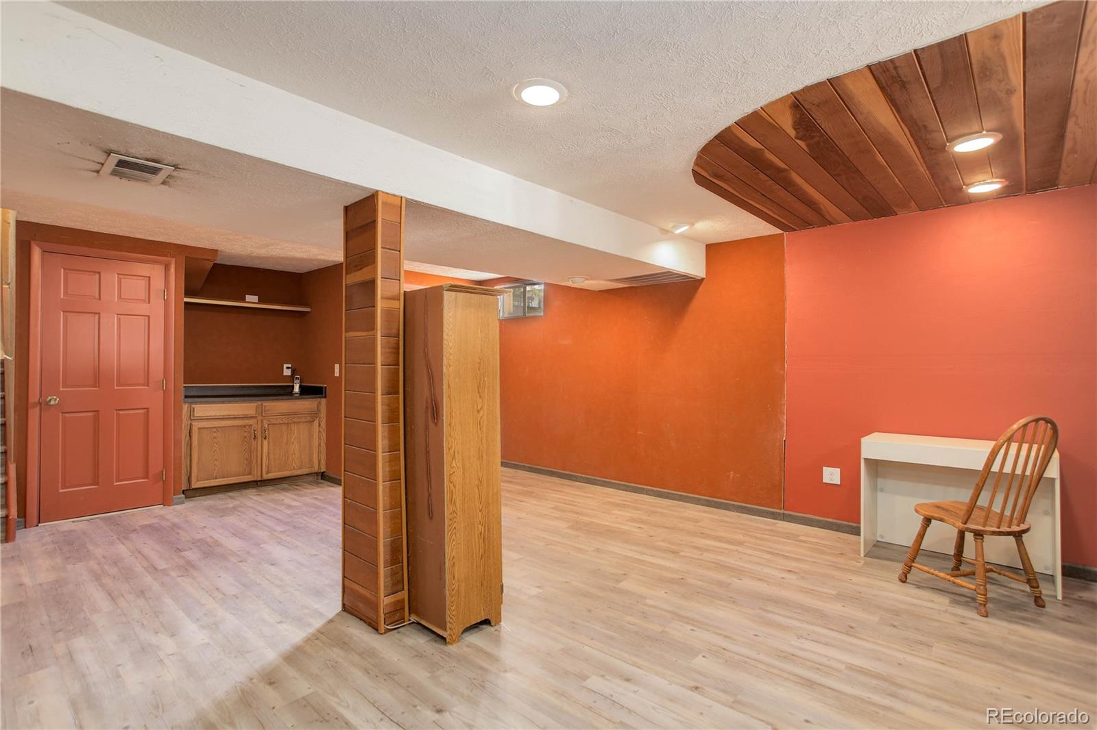 7347 South Ridgeview Drive Littleton, CO 80120 - Photo 30 of 36 a view of a livingroom with a kitchen and lounge chair