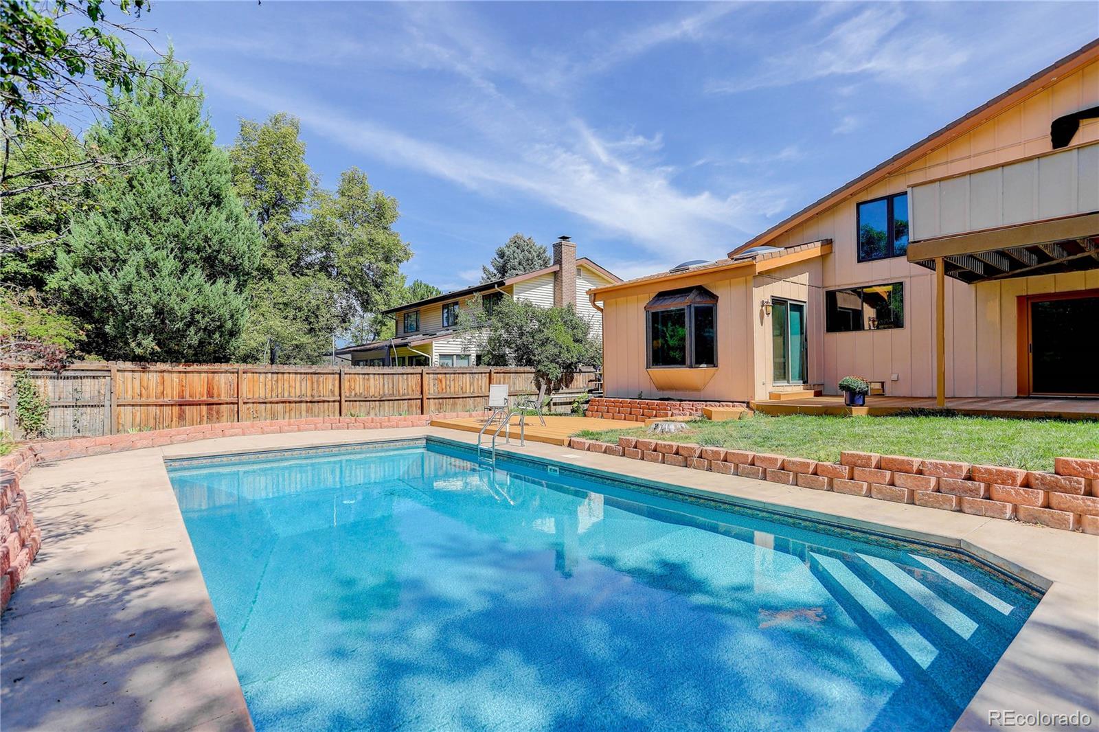 7347 South Ridgeview Drive Littleton, CO 80120 - Photo 33 of 36 a view of a house with swimming pool