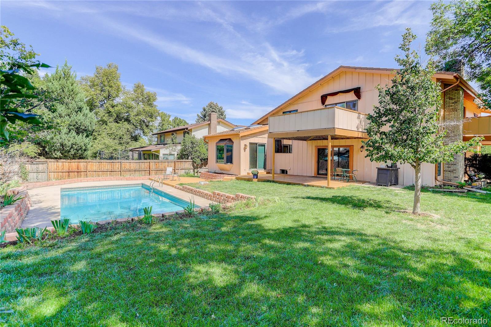 7347 South Ridgeview Drive Littleton, CO 80120 - Photo 34 of 36 a front view of a house with a yard