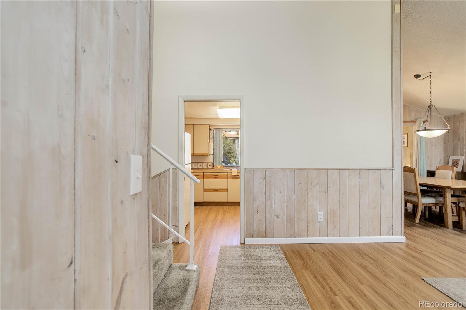 7347 South Ridgeview Drive Littleton, CO 80120 - Photo 4 of 36 a view of a kitchen from the hallway