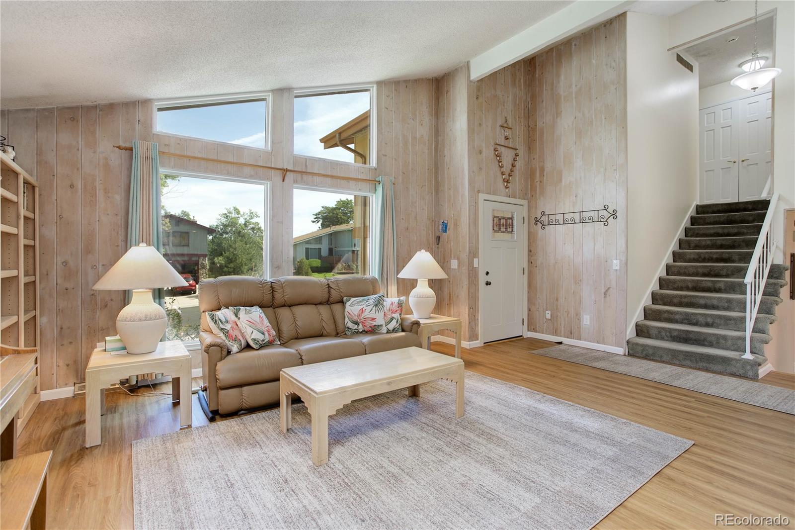 7347 South Ridgeview Drive Littleton, CO 80120 - Photo 5 of 36 a living room with furniture and wooden floor
