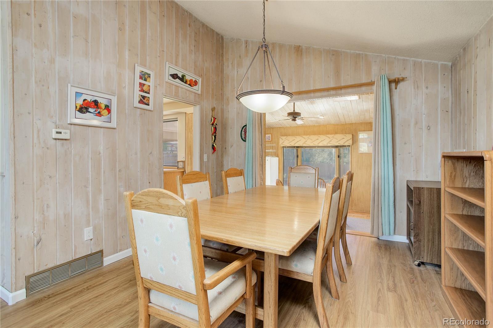 7347 South Ridgeview Drive Littleton, CO 80120 - Photo 8 of 36 a view of a dining room with furniture and wooden floor