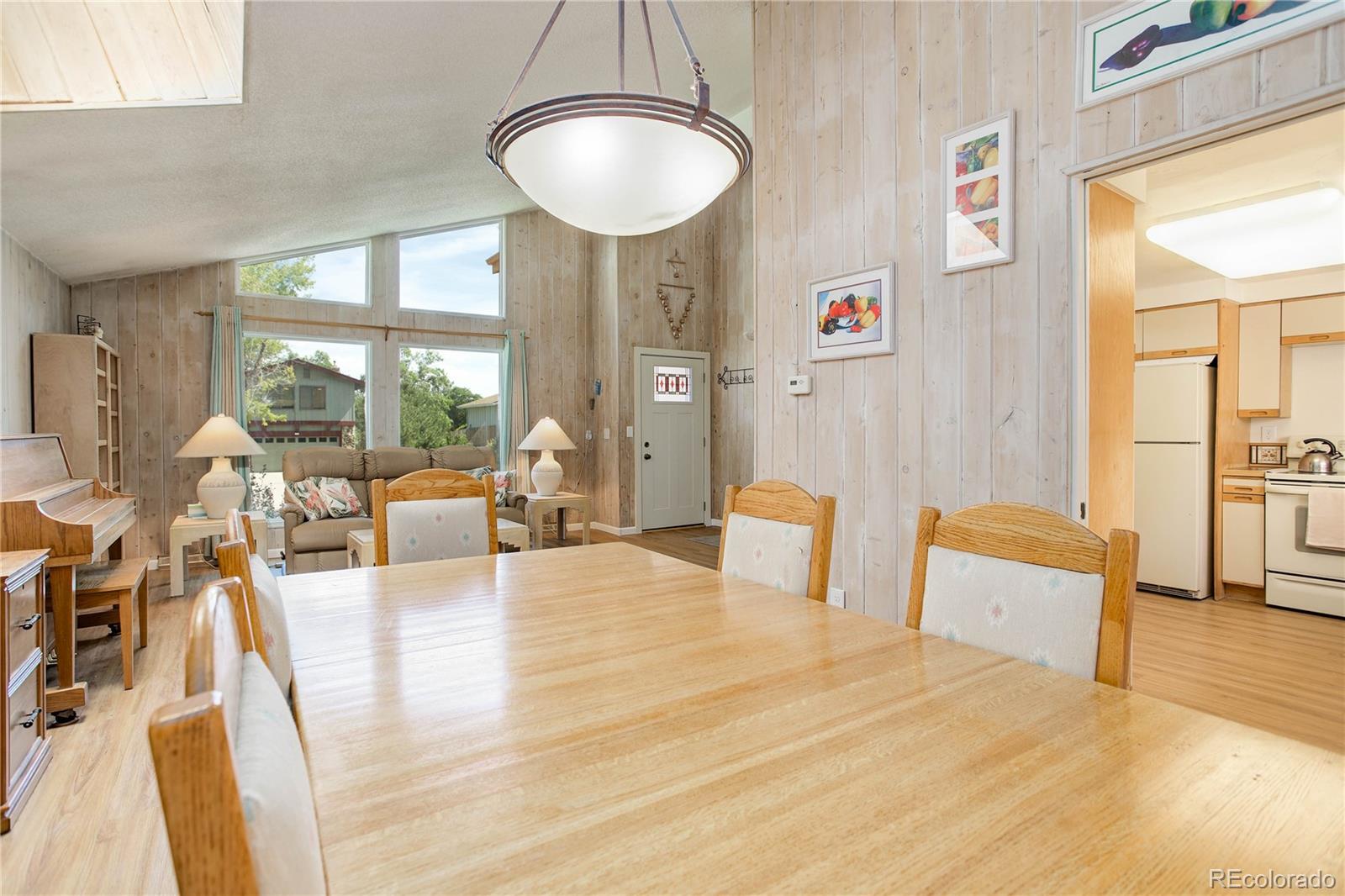7347 South Ridgeview Drive Littleton, CO 80120 - Photo 9 of 36 a living room with furniture and a large window