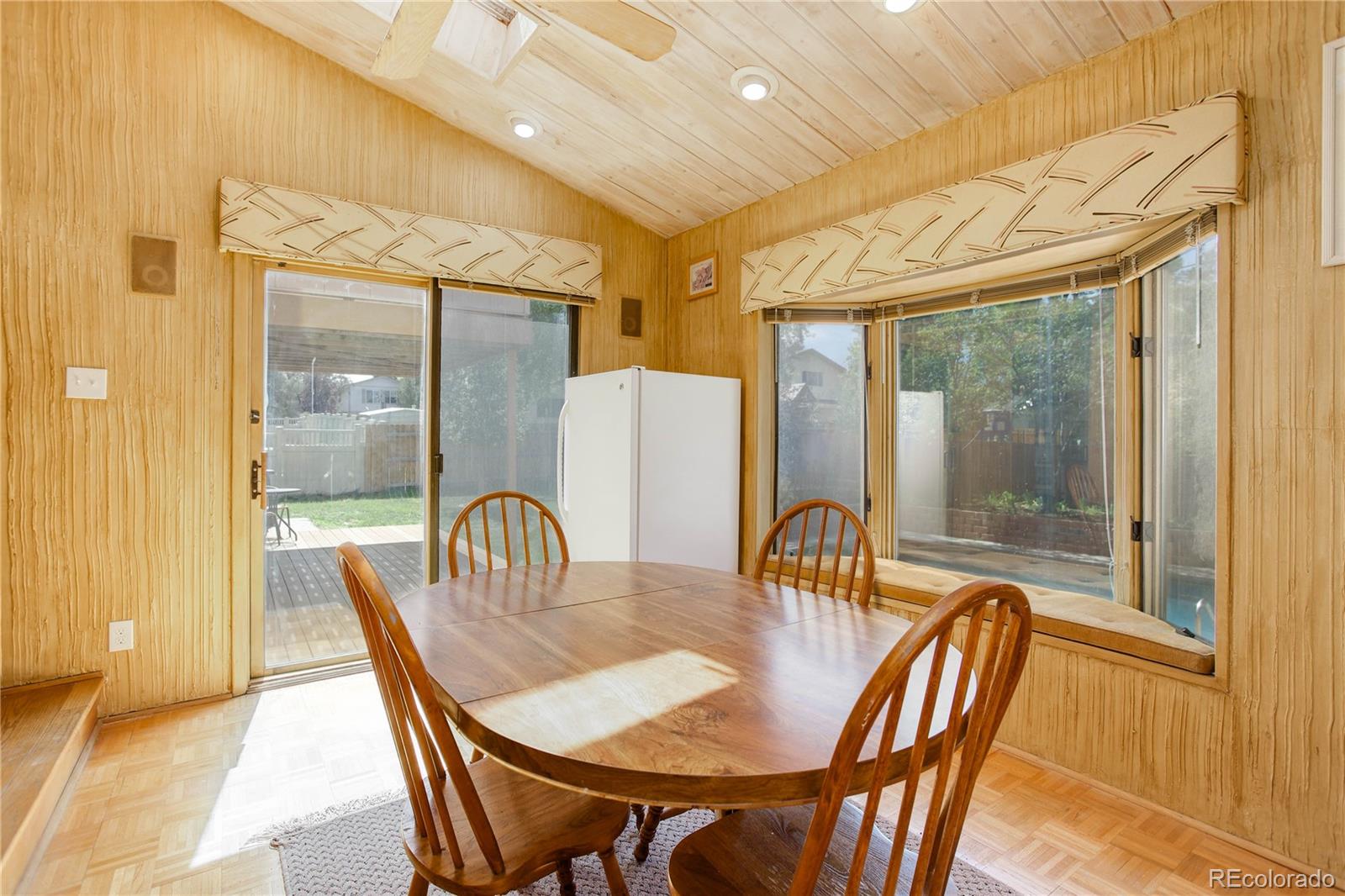 7347 South Ridgeview Drive Littleton, CO 80120 - Photo 10 of 36 a dining room with furniture window and outside view