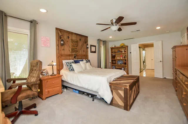 a bed room with a bed and furniture