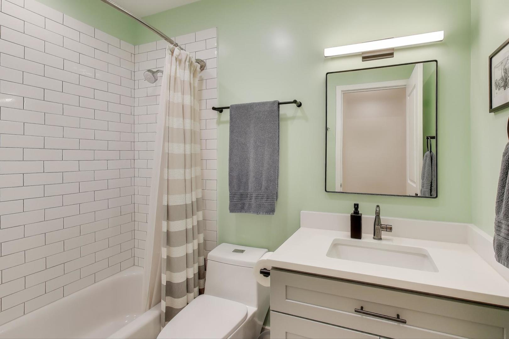 1811 South Laflin Street, Unit 2 Chicago, IL 60608 - Photo 15 of 20 a bathroom with a sink a toilet and shower