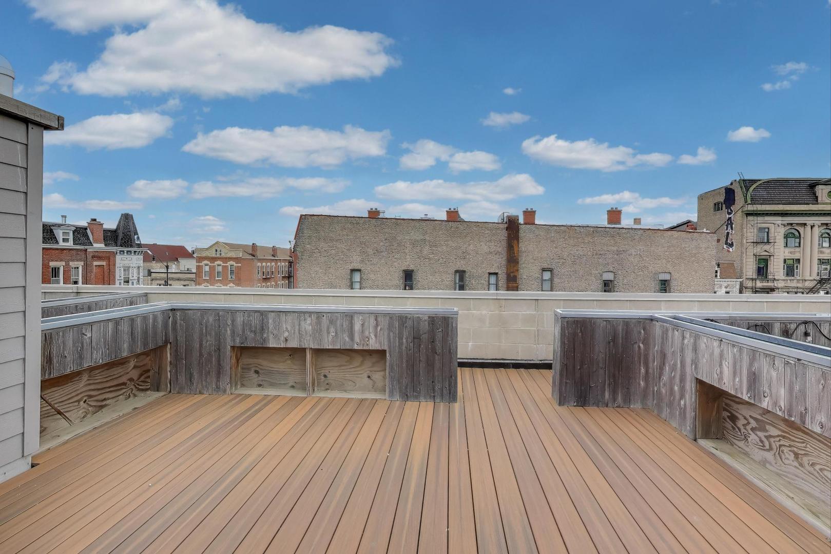 1811 South Laflin Street, Unit 2 Chicago, IL 60608 - Photo 19 of 20 a view of a balcony with wooden floor