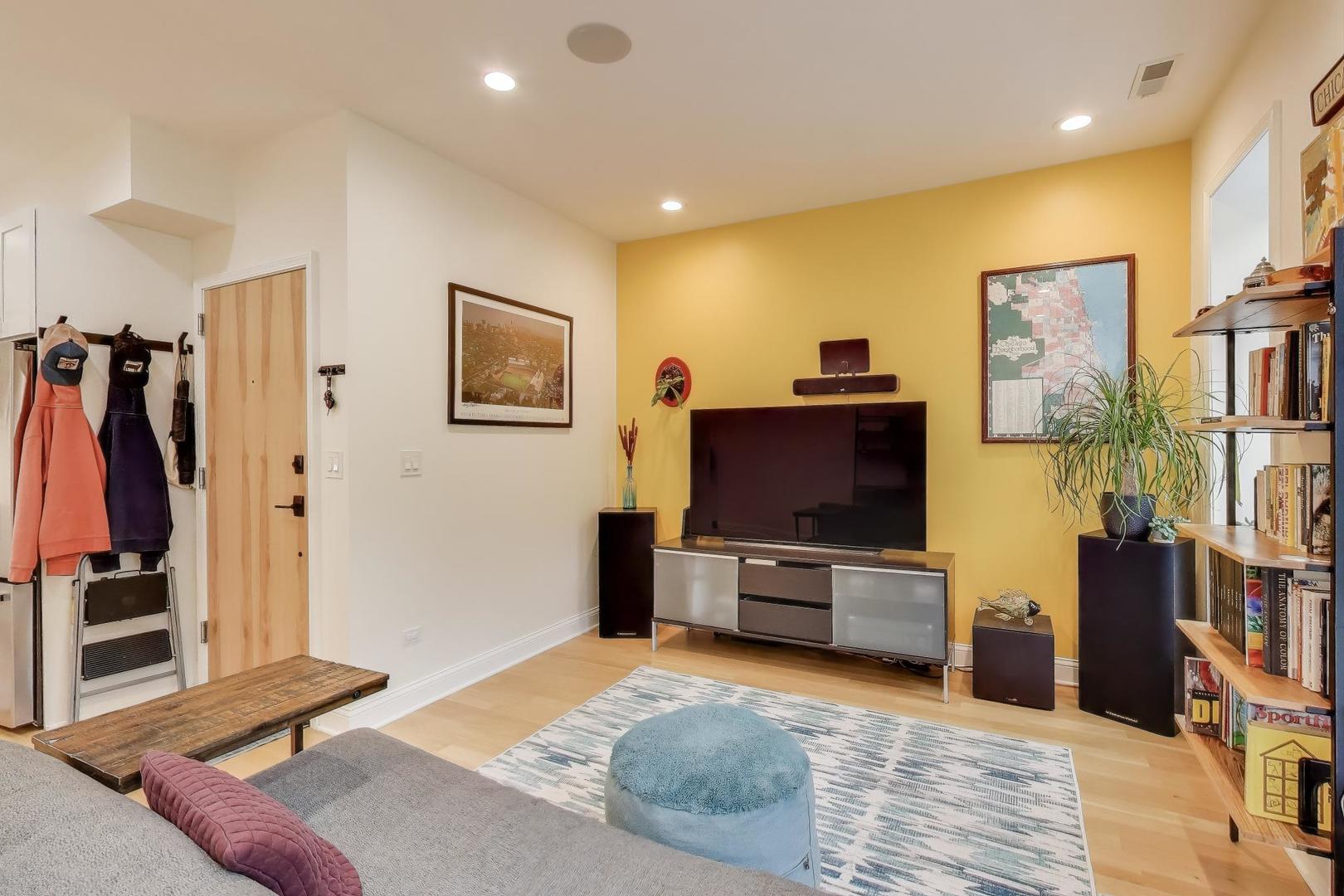 1811 South Laflin Street, Unit 2 Chicago, IL 60608 - Photo 3 of 20 a living room with furniture and a flat screen tv