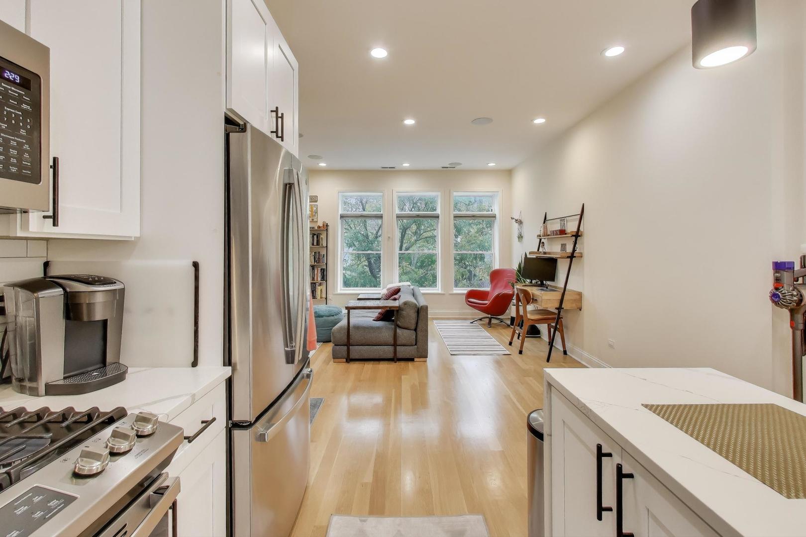 1811 South Laflin Street, Unit 2 Chicago, IL 60608 - Photo 8 of 20 a living room with furniture and a wooden floor