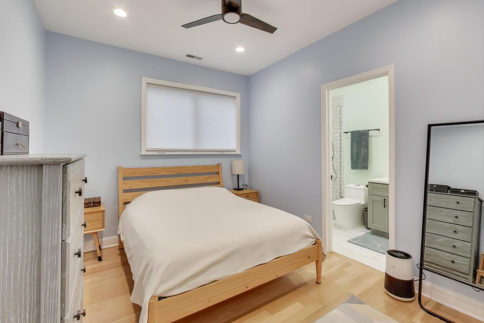 1811 South Laflin Street, Unit 2 Chicago, IL 60608 - Photo 10 of 20 a bedroom with a bed and a view of bathroom