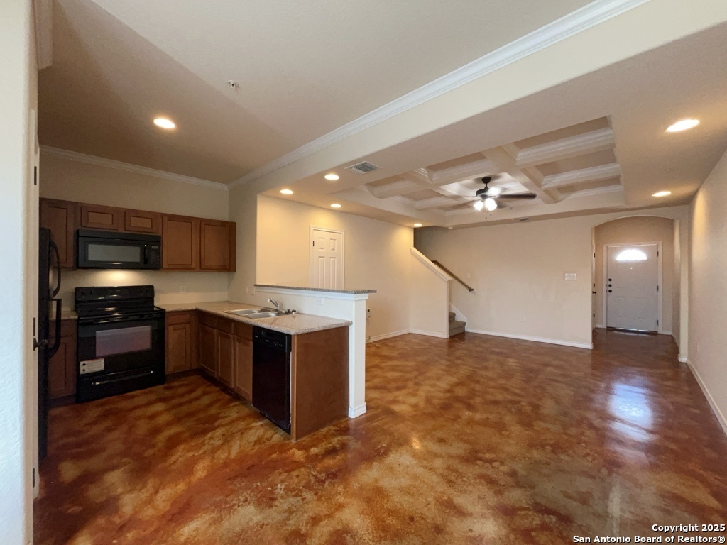 16821 Showdown Path, Unit 3 Selma, TX 78154 - Photo 11 of 37 a kitchen with stainless steel appliances granite countertop a stove and a refrigerator