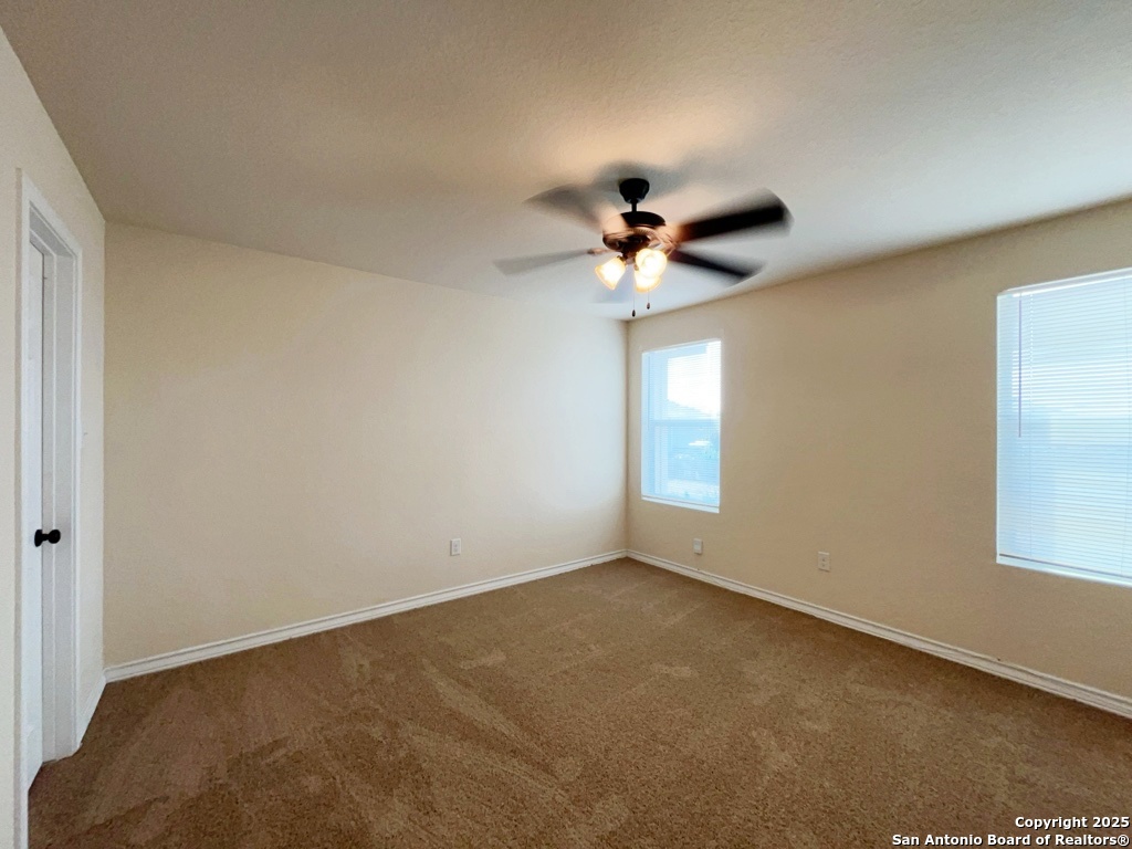 16821 Showdown Path, Unit 3 Selma, TX 78154 - Photo 18 of 37 a view of room with a ceiling fan and window