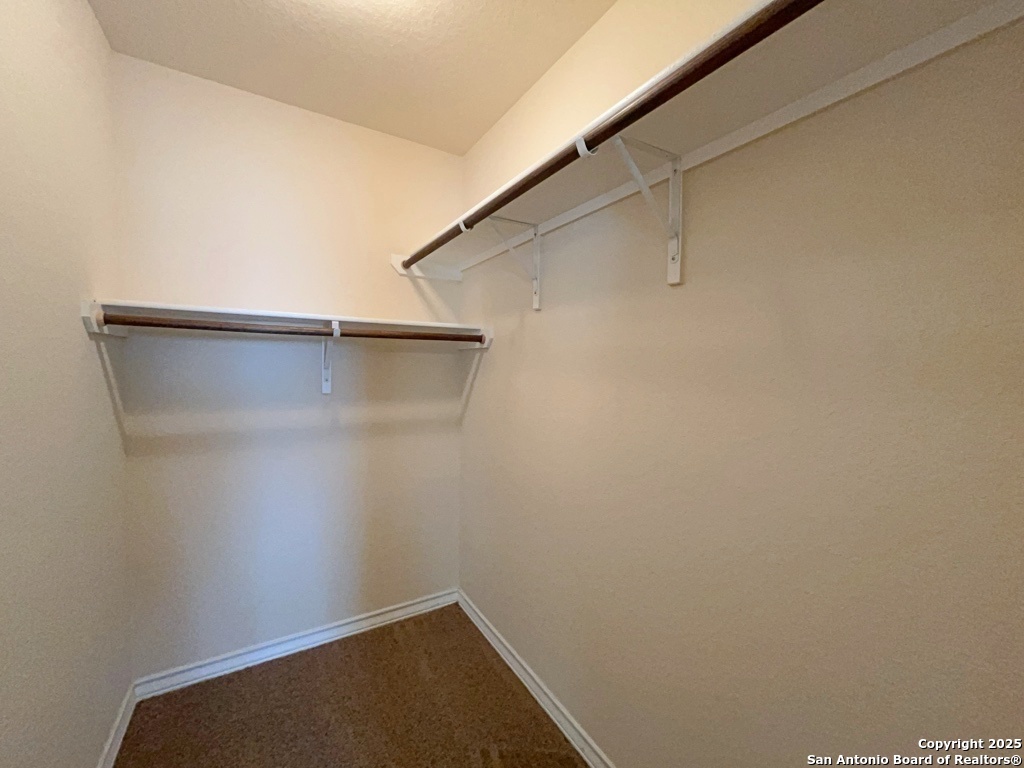 16821 Showdown Path, Unit 3 Selma, TX 78154 - Photo 20 of 37 a view of small space with racks on the wall