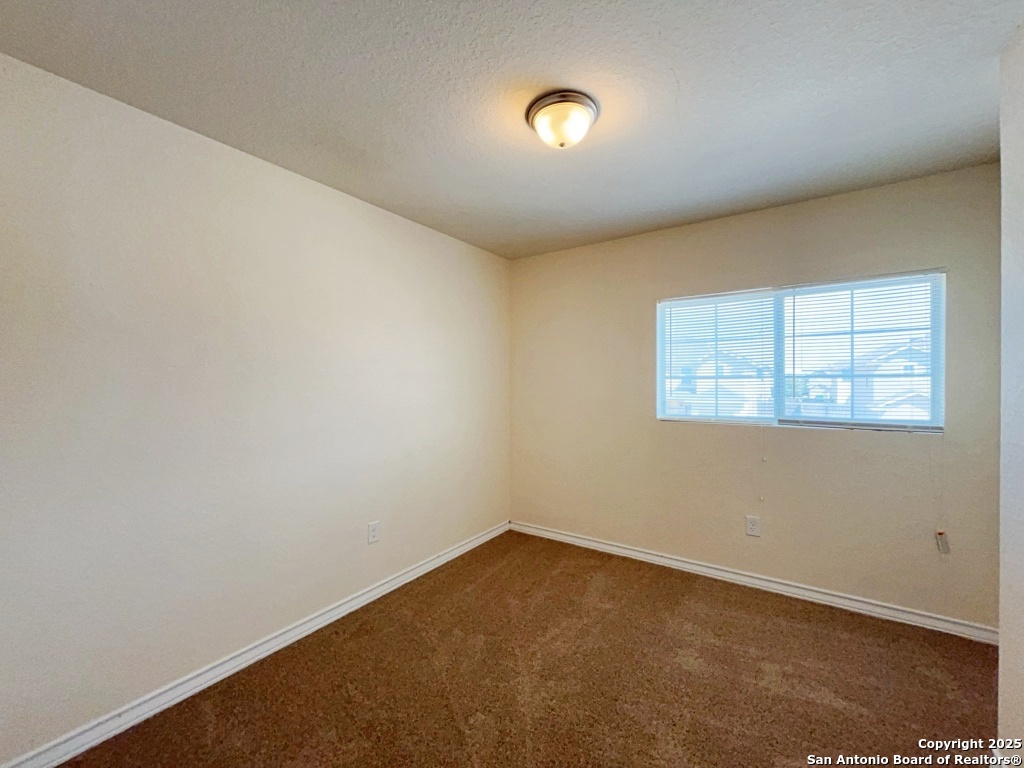 16821 Showdown Path, Unit 3 Selma, TX 78154 - Photo 24 of 37 an empty room with windows