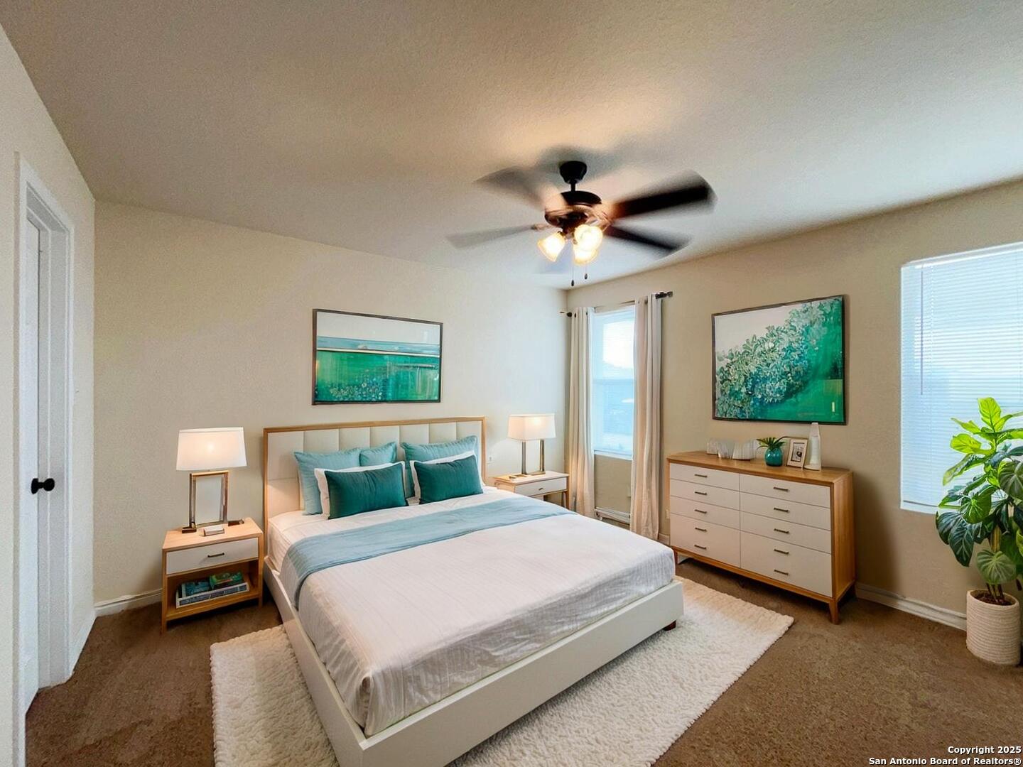 16821 Showdown Path, Unit 3 Selma, TX 78154 - Photo 4 of 37 a bedroom with a bed a chandelier and a flat screen television