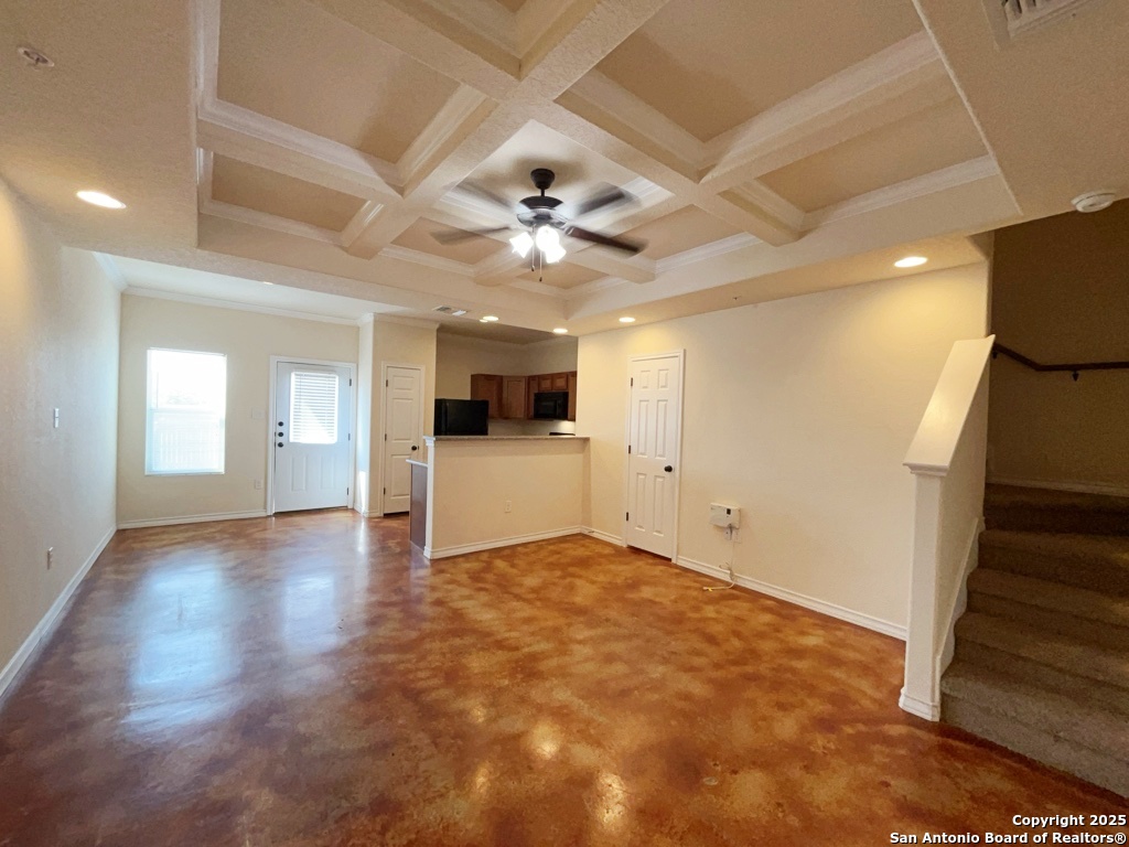16821 Showdown Path, Unit 3 Selma, TX 78154 - Photo 8 of 37 a view of empty room with wooden floor and ceiling fan
