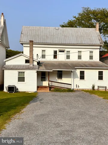 a front view of house with yard