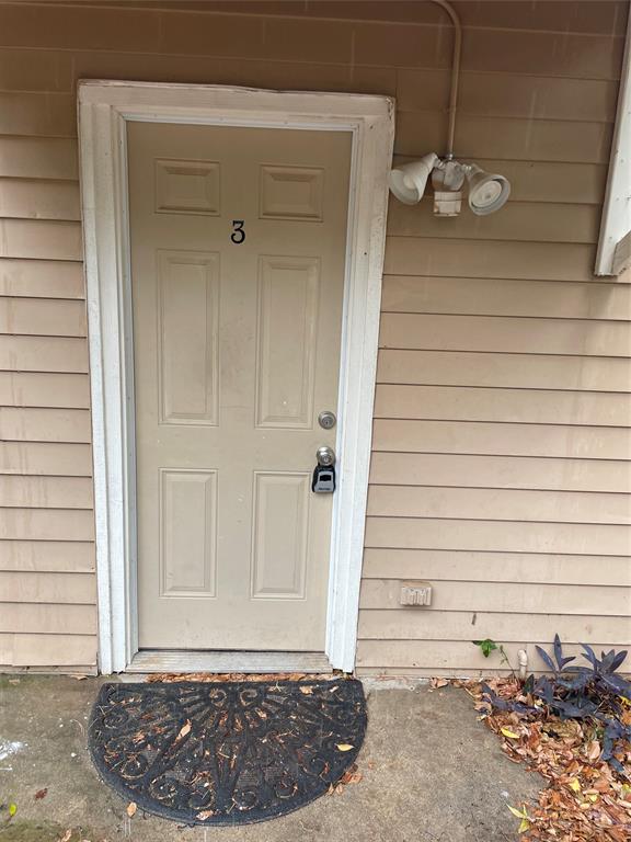 902 West Hickory Street, Unit 3 Denton, TX 76201 - Photo 1 of 1 a view of wooden door