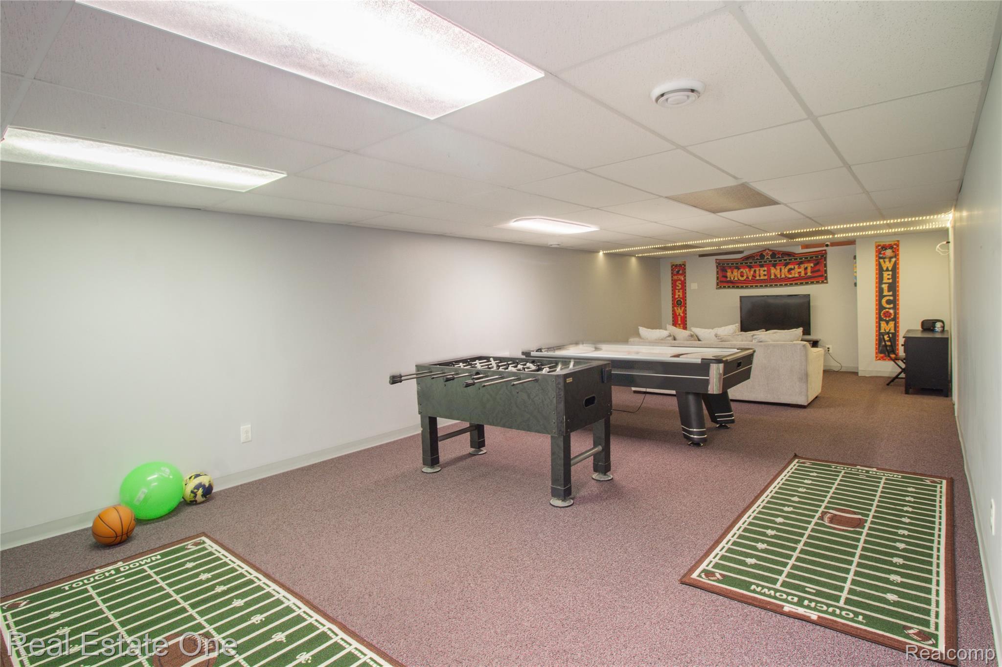 44220 Saltz Road Canton, MI 48187 - Photo 15 of 31 Spacious finished room featuring plush purple carpeting, white walls, and a dropped ceiling with integrated lighting