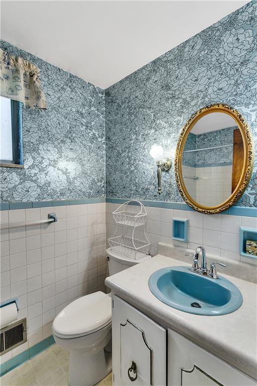 767 Beulah Road Pittsburgh, PA 15235 - Photo 21 of 25 a bathroom with a sink and a mirror