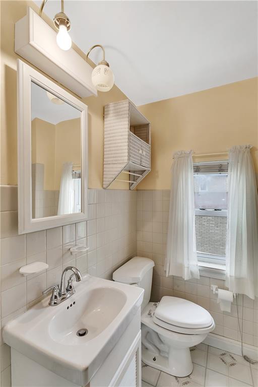 767 Beulah Road Pittsburgh, PA 15235 - Photo 24 of 25 a bathroom with a sink mirror and toilet
