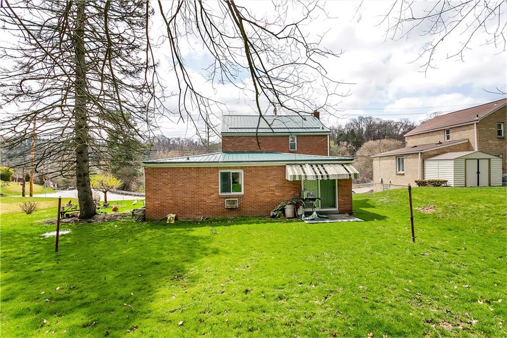 767 Beulah Road Pittsburgh, PA 15235 - Photo 4 of 25 a view of a house with a yard