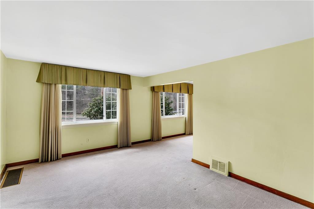 767 Beulah Road Pittsburgh, PA 15235 - Photo 8 of 25 an empty room with windows