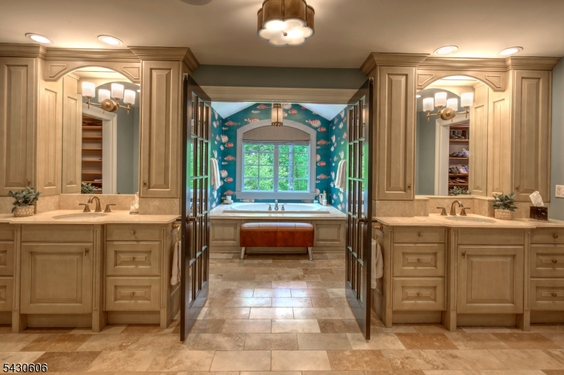5 Burnett Road Mendham, NJ 07945 - Photo 22 of 50 a bathroom with a double vanity sink and a mirror