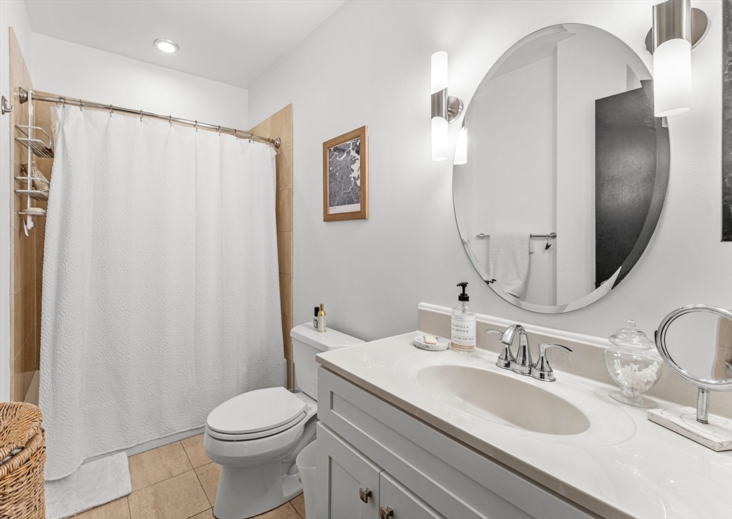 101 Broad Street, Unit 3B Boston, MA 02110 - Photo 12 of 19 a bathroom with a sink toilet and shower