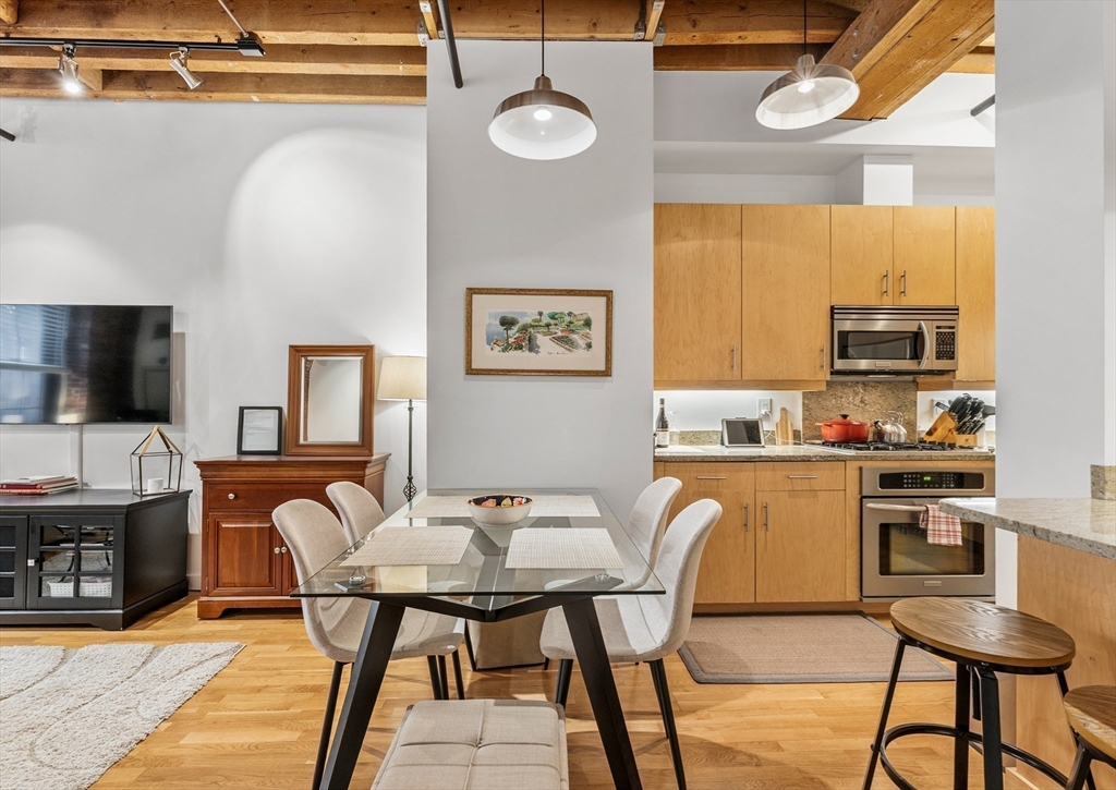 101 Broad Street, Unit 3B Boston, MA 02110 - Photo 8 of 19 a view of a dining room with furniture