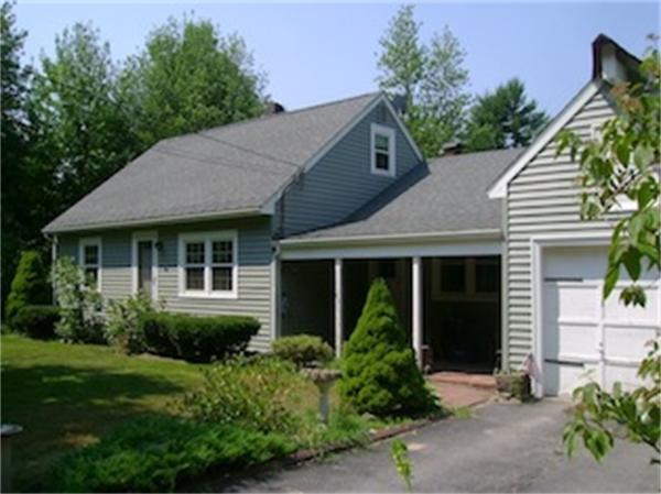 a view of a house with garden and yard