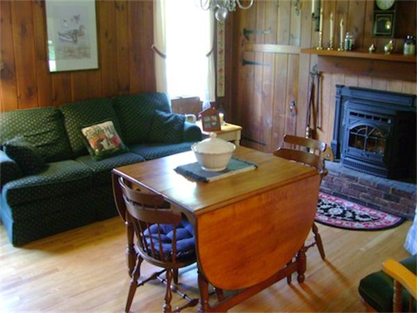 274 Wallace Hill Road Townsend, MA 01469 - Photo 11 of 27 a living room with furniture and a fireplace