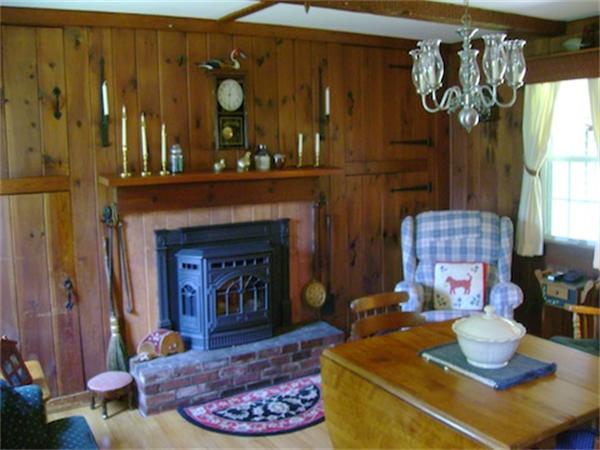 274 Wallace Hill Road Townsend, MA 01469 - Photo 12 of 27 a living room with furniture and a fireplace