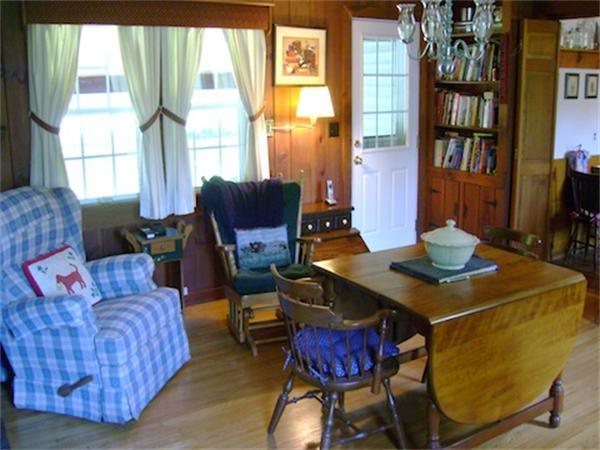 274 Wallace Hill Road Townsend, MA 01469 - Photo 13 of 27 a living room with furniture a bookshelf and a window