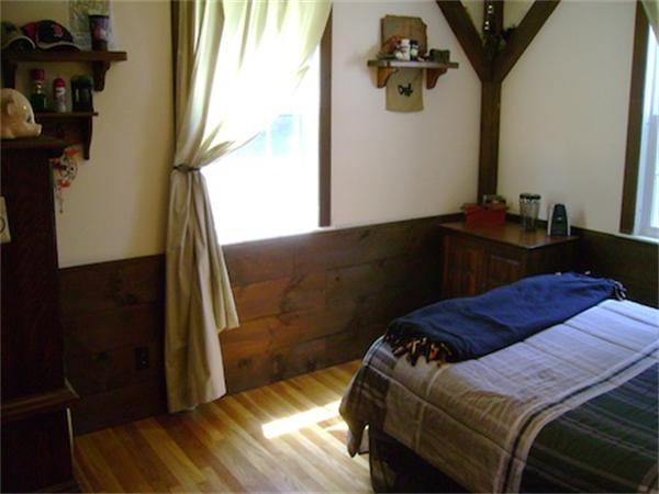 274 Wallace Hill Road Townsend, MA 01469 - Photo 18 of 27 a bedroom with a bed and wooden floor