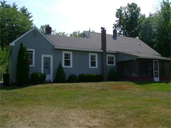 274 Wallace Hill Road Townsend, MA 01469 - Photo 26 of 27 a front view of a house with a yard