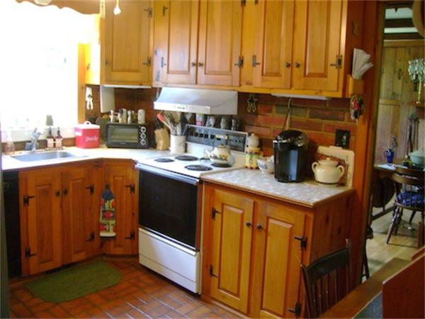 274 Wallace Hill Road Townsend, MA 01469 - Photo 3 of 27 a kitchen with stainless steel appliances granite countertop a stove a sink and a refrigerator