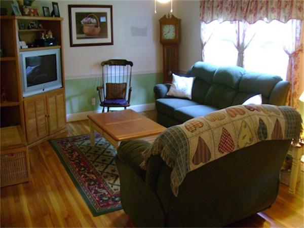 274 Wallace Hill Road Townsend, MA 01469 - Photo 4 of 27 a living room with furniture and a flat screen tv