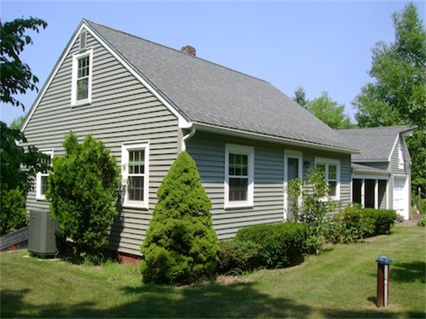 274 Wallace Hill Road Townsend, MA 01469 - Photo 5 of 27 a front view of a house with a yard