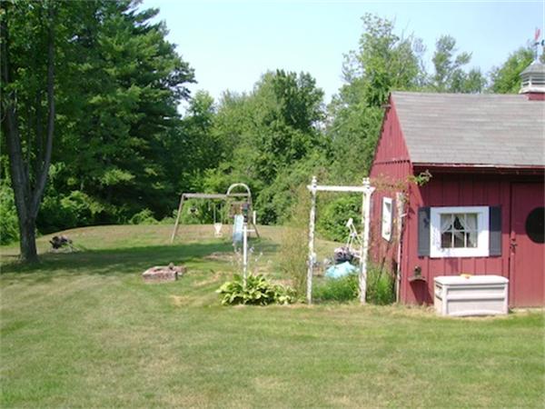 274 Wallace Hill Road Townsend, MA 01469 - Photo 9 of 27 a view of a house with backyard