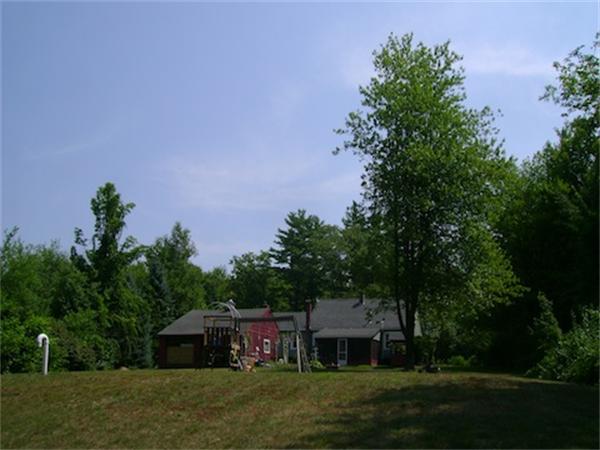 274 Wallace Hill Road Townsend, MA 01469 - Photo 10 of 27 a front view of a house with a garden